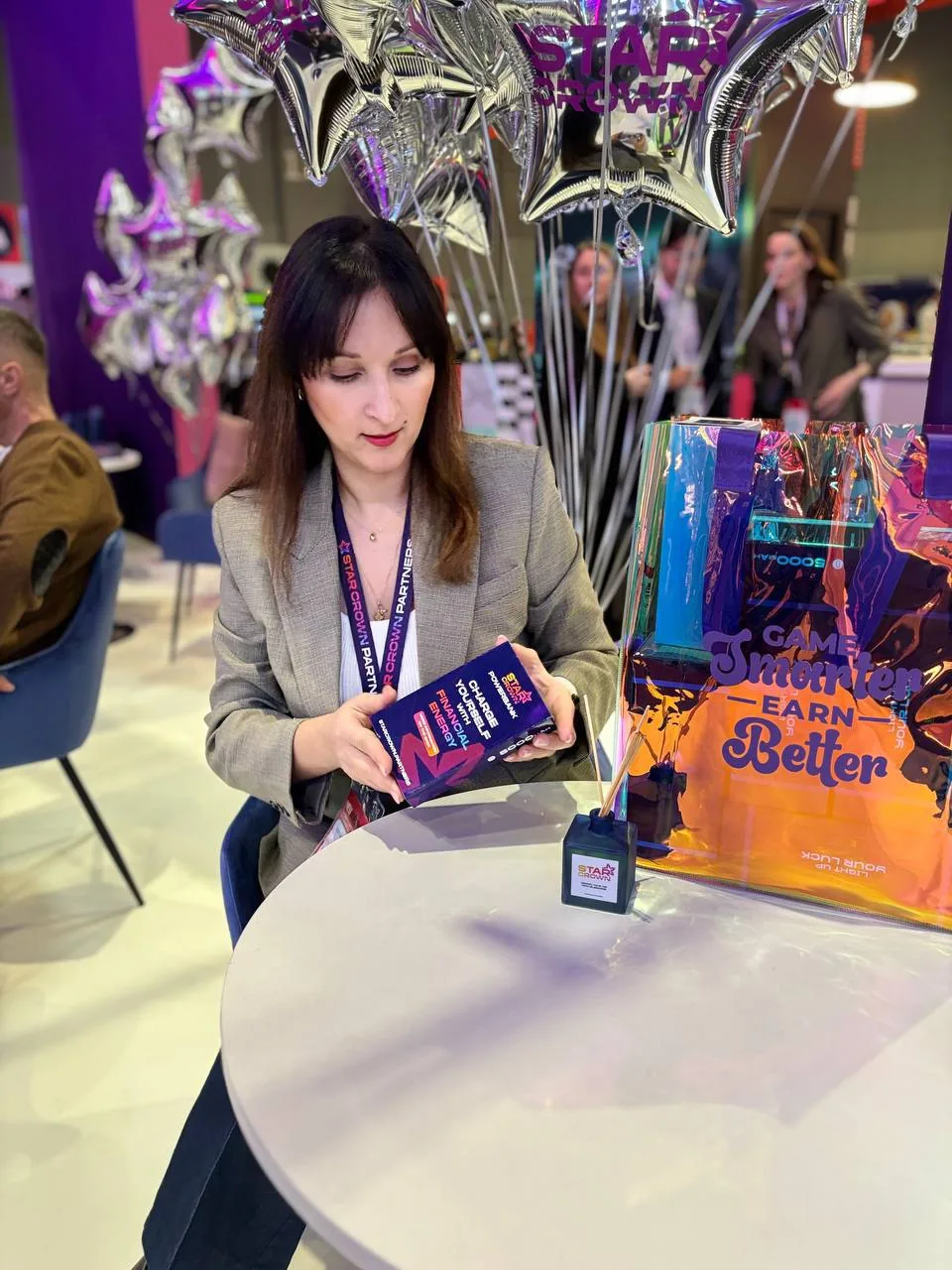 StarCrown booth at iGB in Barcelona with holographic bags