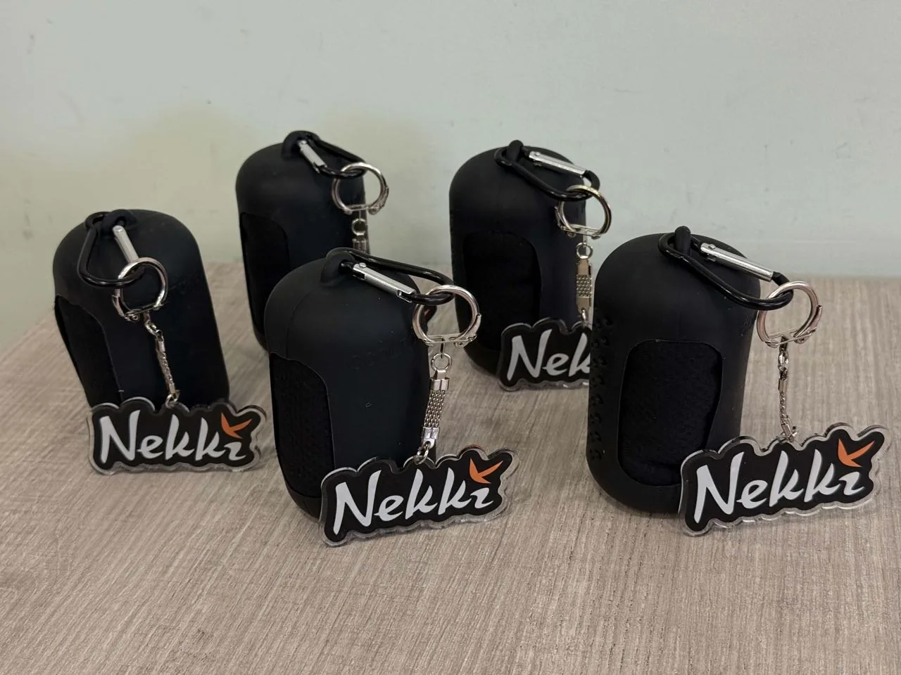Compact towel cases and Nekki keyrings
