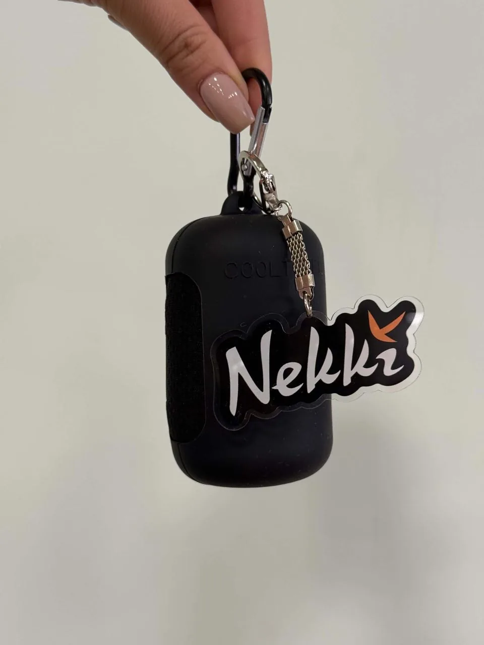 Nekki keyring attached to a clip-on case
